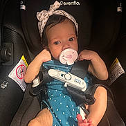 Ava joined the competition — help win amazing prizes! baby, infant, car_seat, pacifier, headband, polka_dot, clothing, child, safety_harness, seatbelt, cute, small_feet, indoor, person, newborn, face, eyes, arm, legs, baby_girl