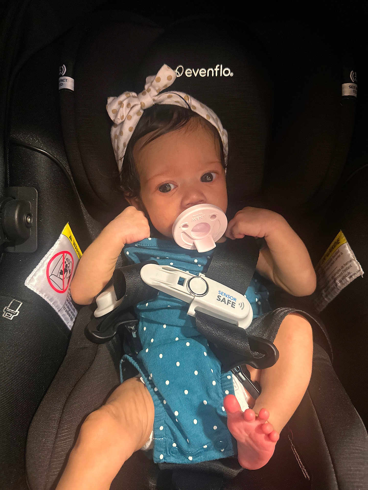 Ava joined the competition — help win amazing prizes! baby, infant, car_seat, pacifier, headband, polka_dot, clothing, child, safety_harness, seatbelt, cute, small_feet, indoor, person, newborn, face, eyes, arm, legs, baby_girl
