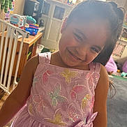 Emelina is registered to the contest to win money with this photo: child, girl, smiling, dress, pink, butterflies, embroidery, bow, indoors, toys, window, natural_light, happy, cute, playroom, furniture, hair_tie, portrait, childhood, home