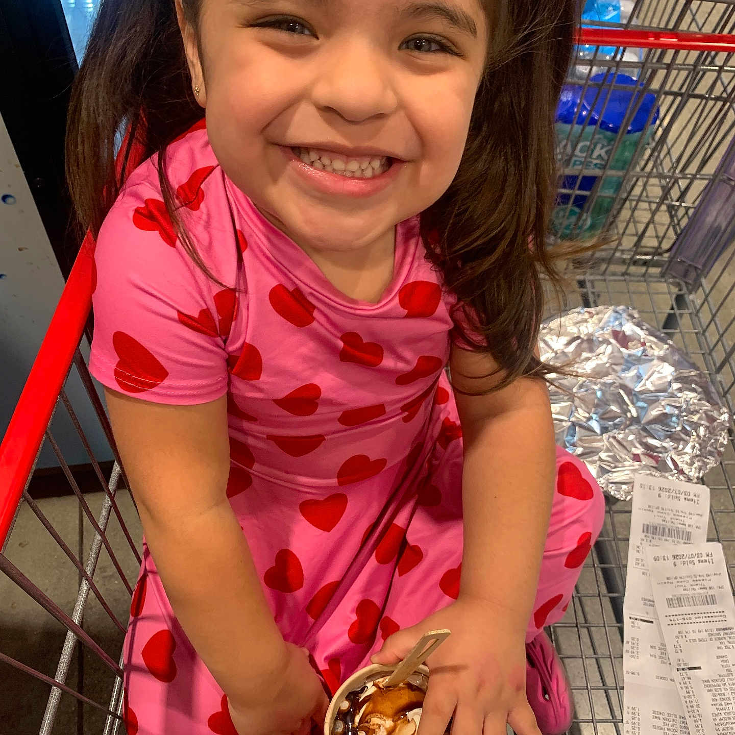 Emelina joined the competition — help win amazing prizes! child, girl, smiling, shopping_cart, ice_cream, pink_dress, hearts_pattern, happy, food, retail, receipt, foil_wrap, indoor, person, long_hair, casual_clothing, cute, sweet, holding, playful