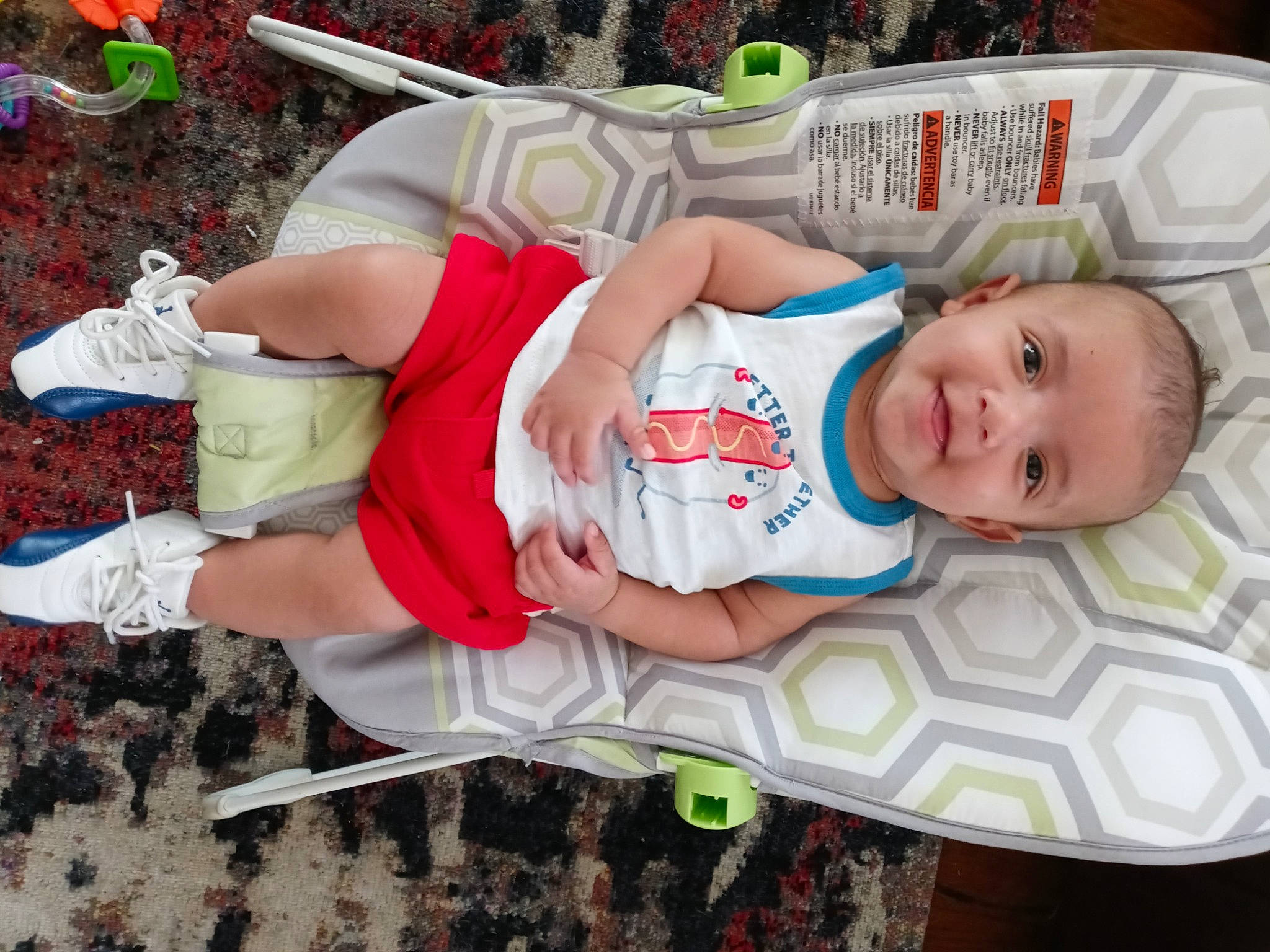 Jermaine is registered to the contest to win money with this photo: baby, baby_products, baby_safety, baby_toddler_clothing, carmine, child, diaper, fictional_character, hat, human_leg, linens, pattern, person, product, sleeve, smile, sock, t_shirt, textile, thigh