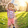 blossom, bunny_ears, child, cute, daylight, easter_eggs, grass, happy, nature, outdoor, path, portrait, shirt, shoes, shorts, spring, sunlight, suspenders, toddler, tree