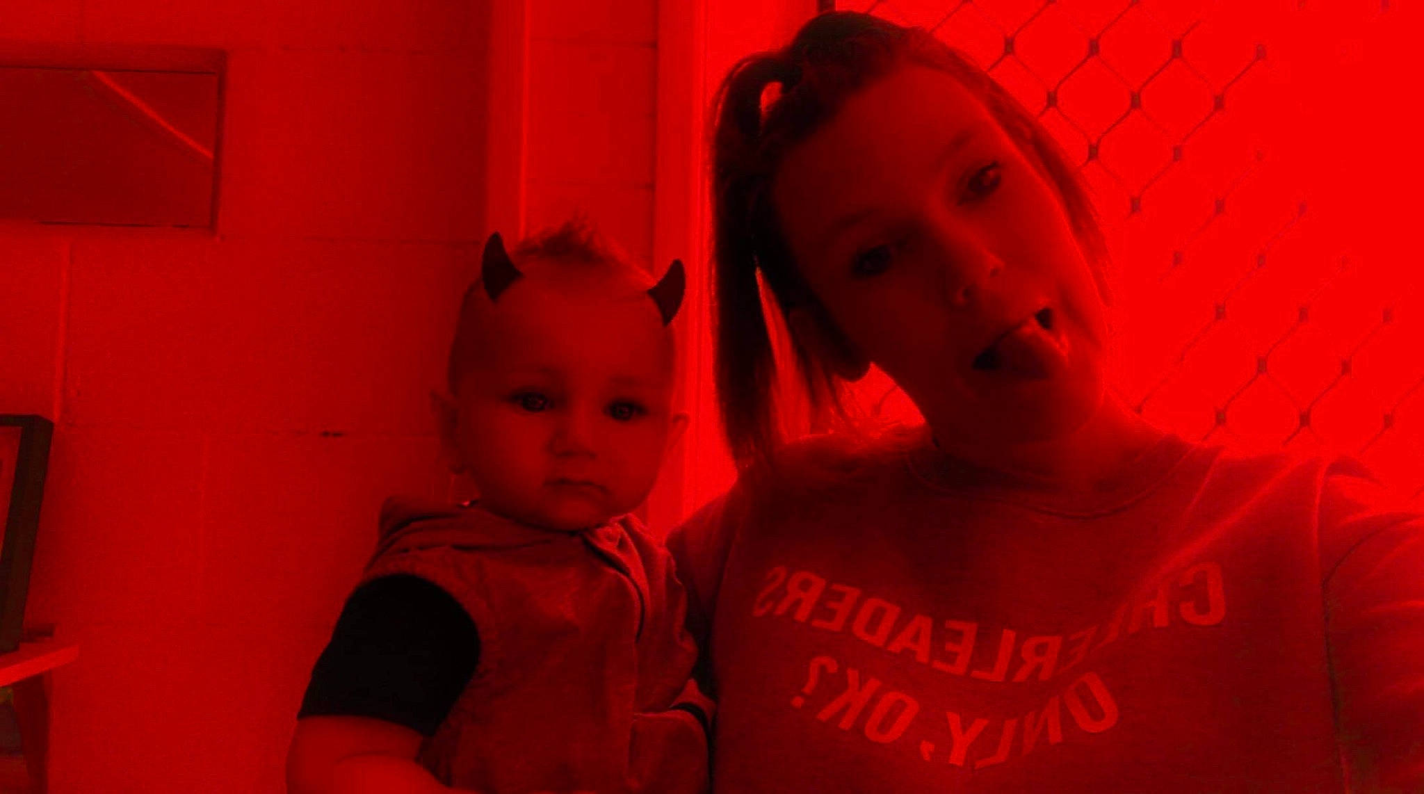 Kobi is registered to the contest to win money with this photo: child, flesh, fun, magenta, mouth, person, pink, red, room, smile, under_exposed