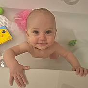 Freda joined the competition — help win amazing prizes! baby, bathtub, water, child, smile, hands, toy, book, bath, playful, skin, face, happy, young_child, indoor, person, head, necklace, bathroom, cute