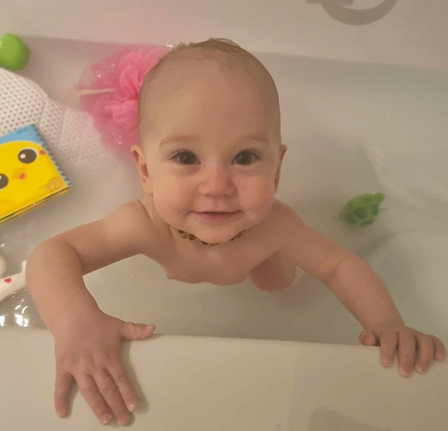 Freda joined the competition — help win amazing prizes! baby, bathtub, water, child, smile, hands, toy, book, bath, playful, skin, face, happy, young_child, indoor, person, head, necklace, bathroom, cute