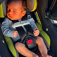Gianluca is registered to the contest to win money with this photo: baby, car_seat, infant, sleeping, harness, sensor_safe, child, seatbelt, sunlight, peaceful, newborn, clothing, fingers, toes, car_interior, safety, resting, head_support, seat, closeup