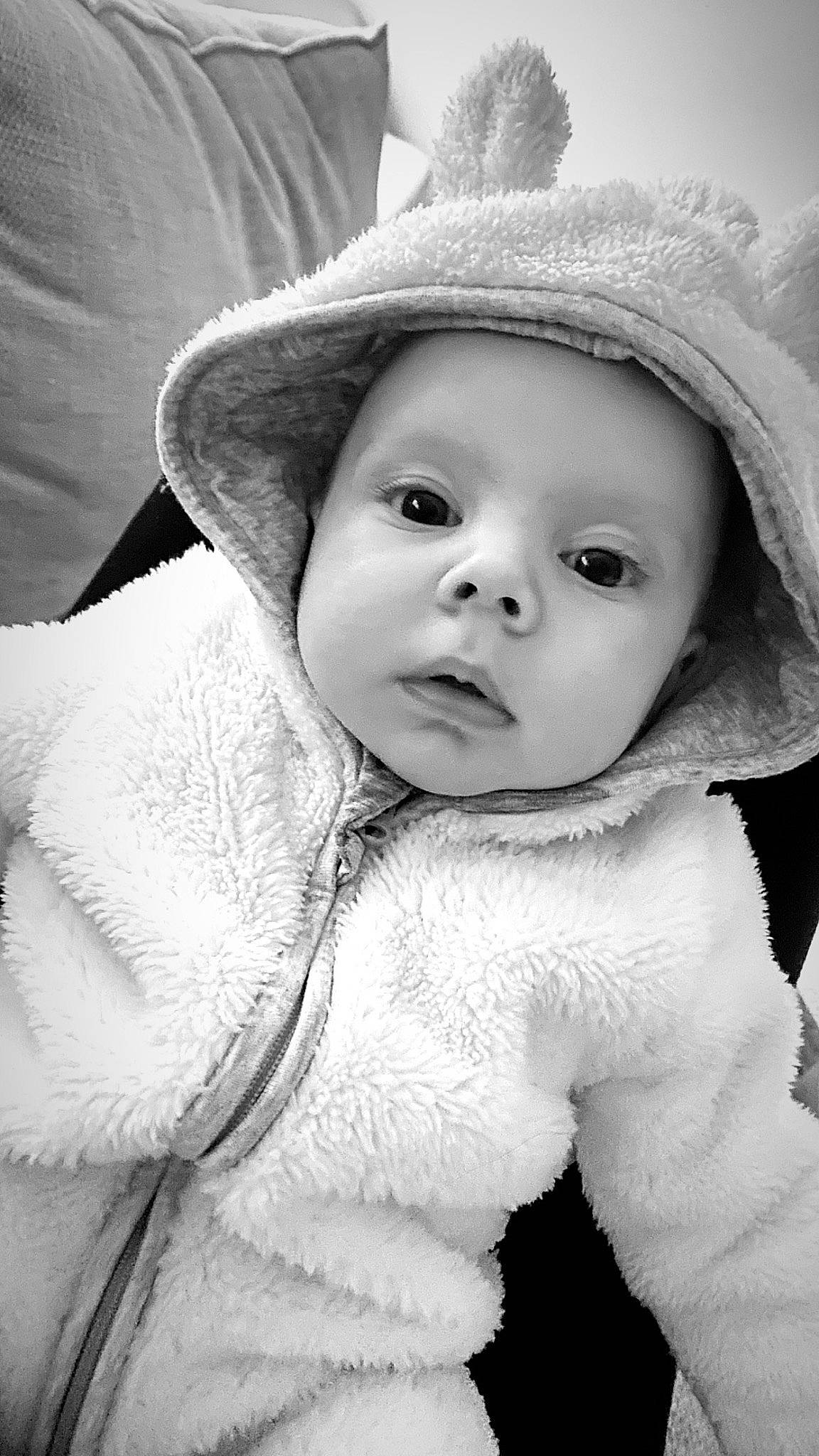 Fletcher is registered to the contest to win money with this photo: baby, cap, cheek, eye, eyebrow, face, facial_expression, flash_photography, happy, hat, headwear, human_body, iris, lip, nose, person, photograph, skin, style, sun_hat