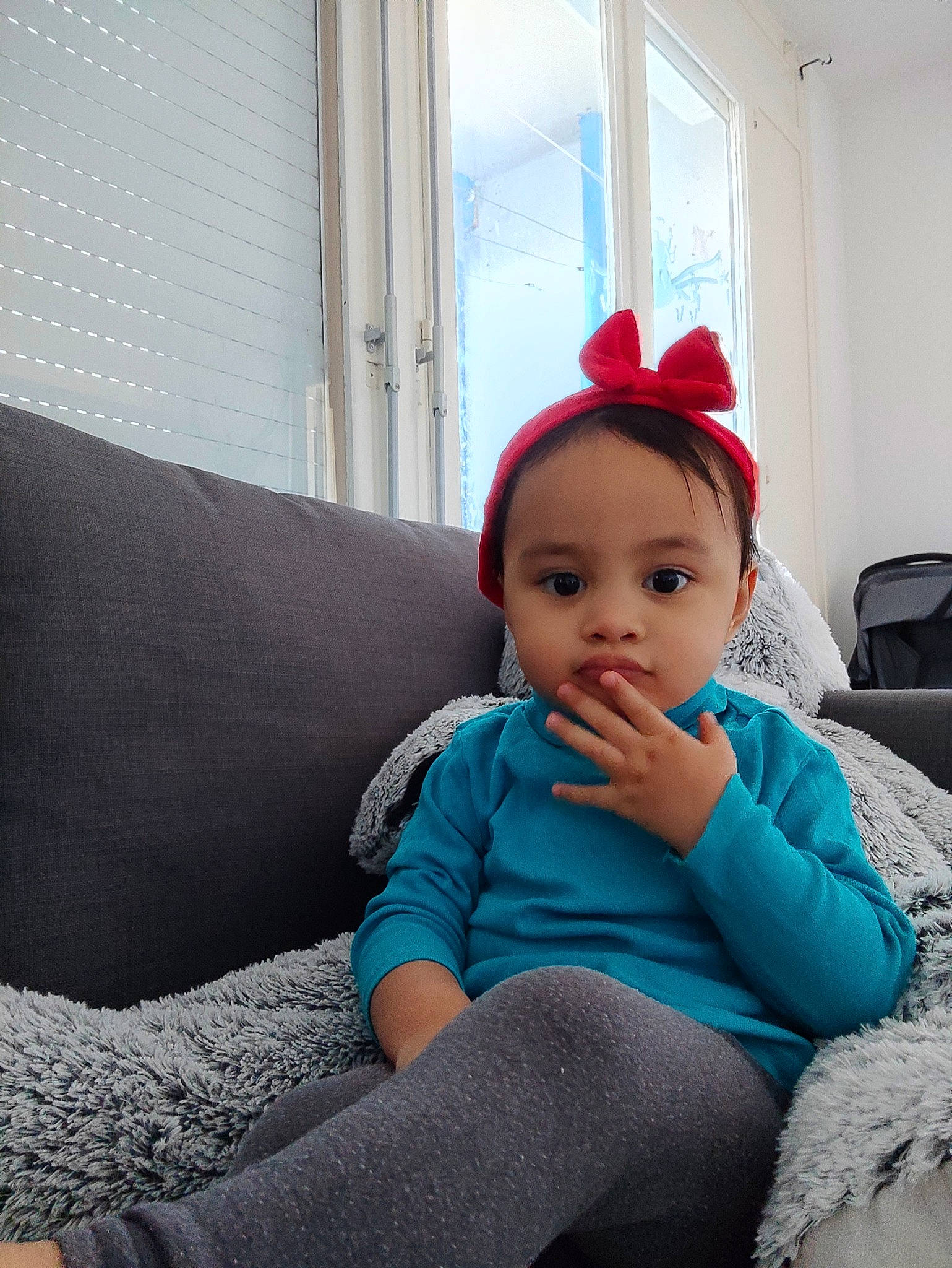 Hope participe au concours pour gagner de l'argent avec cette photo : baby, baby_toddler_clothing, cap, child, comfort, couch, electric_blue, fashion_accessory, flooring, fun, headgear, human_leg, person, purple, room, sitting, sleeve, thigh, toddler, window