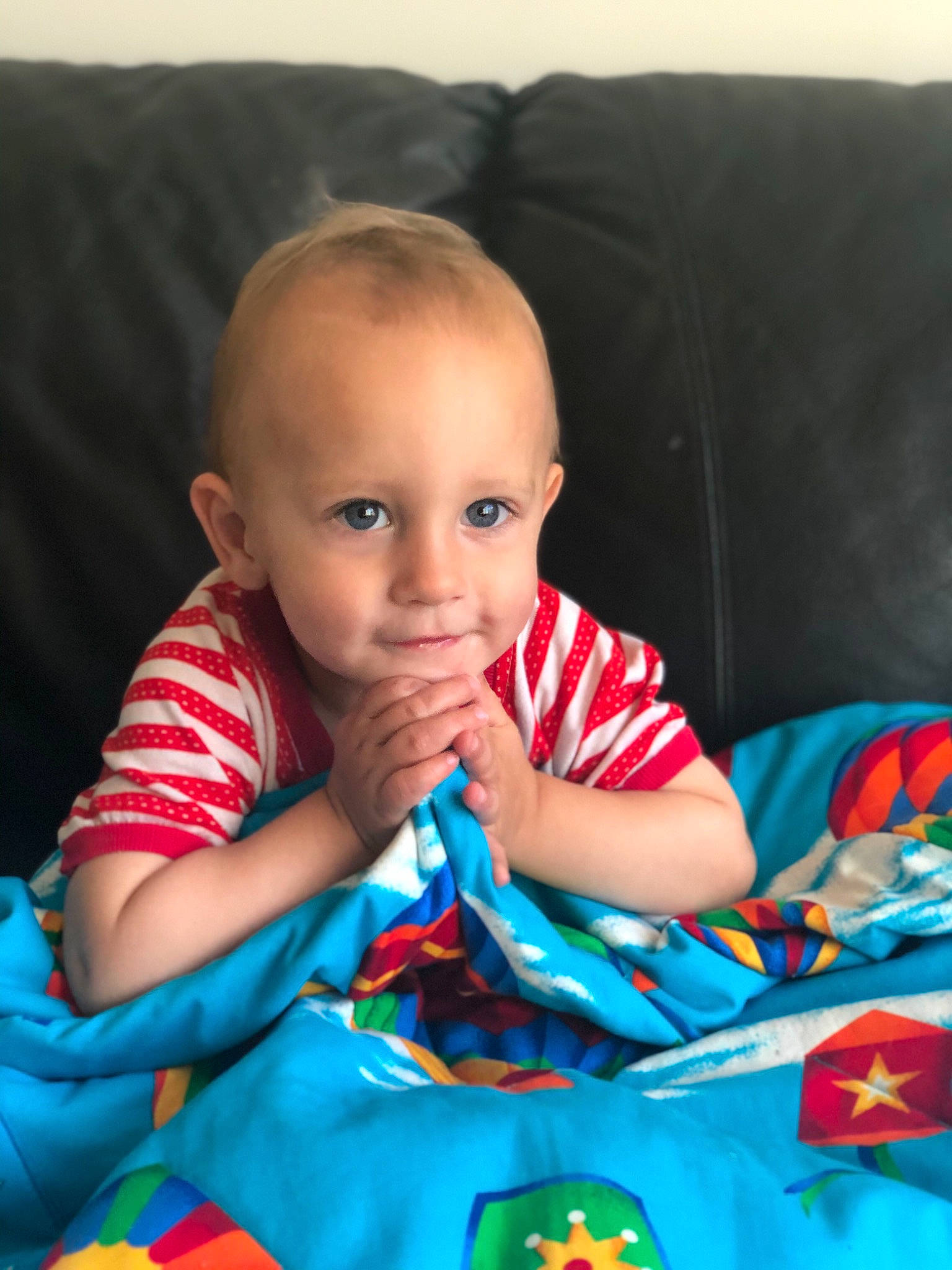 Zackery is registered to the contest to win money with this photo: baby, baby_playing_with_toys, baby_products, baby_toys, blue, cheek, child, eye, face, head, iris, lip, nose, person, play, product, sitting, skin, textile, toddler