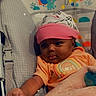 Emani joined the competition — help win amazing prizes! baby, infant, child, blanket, hat, baby_chair, cartoon, rainbow, elephant, monkey, orange_clothing, cozy, reaching_hand, cute, indoor, portrait, young_child, happy, soft_texture, colorful