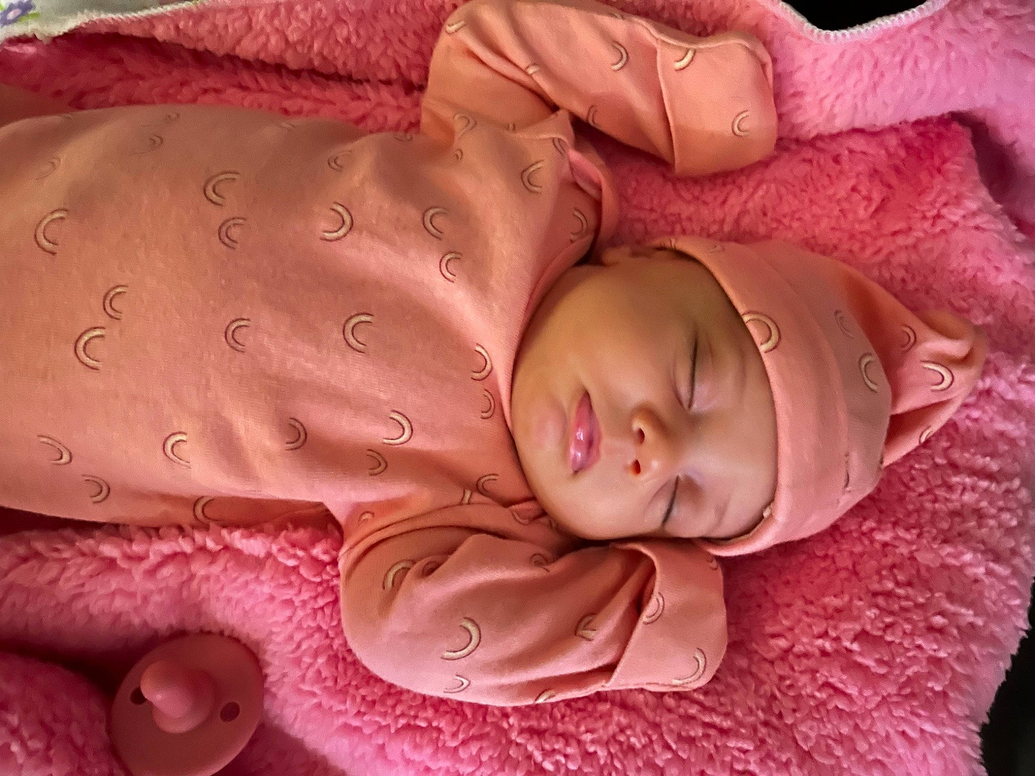 Elliana is registered to the contest to win money with this photo: baby, baby_products, baby_sleeping, baby_toddler_clothing, bed, bedding, bedtime, cheek, child, comfort, head, headwear, linens, magenta, person, pink, product, skin, textile, toddler