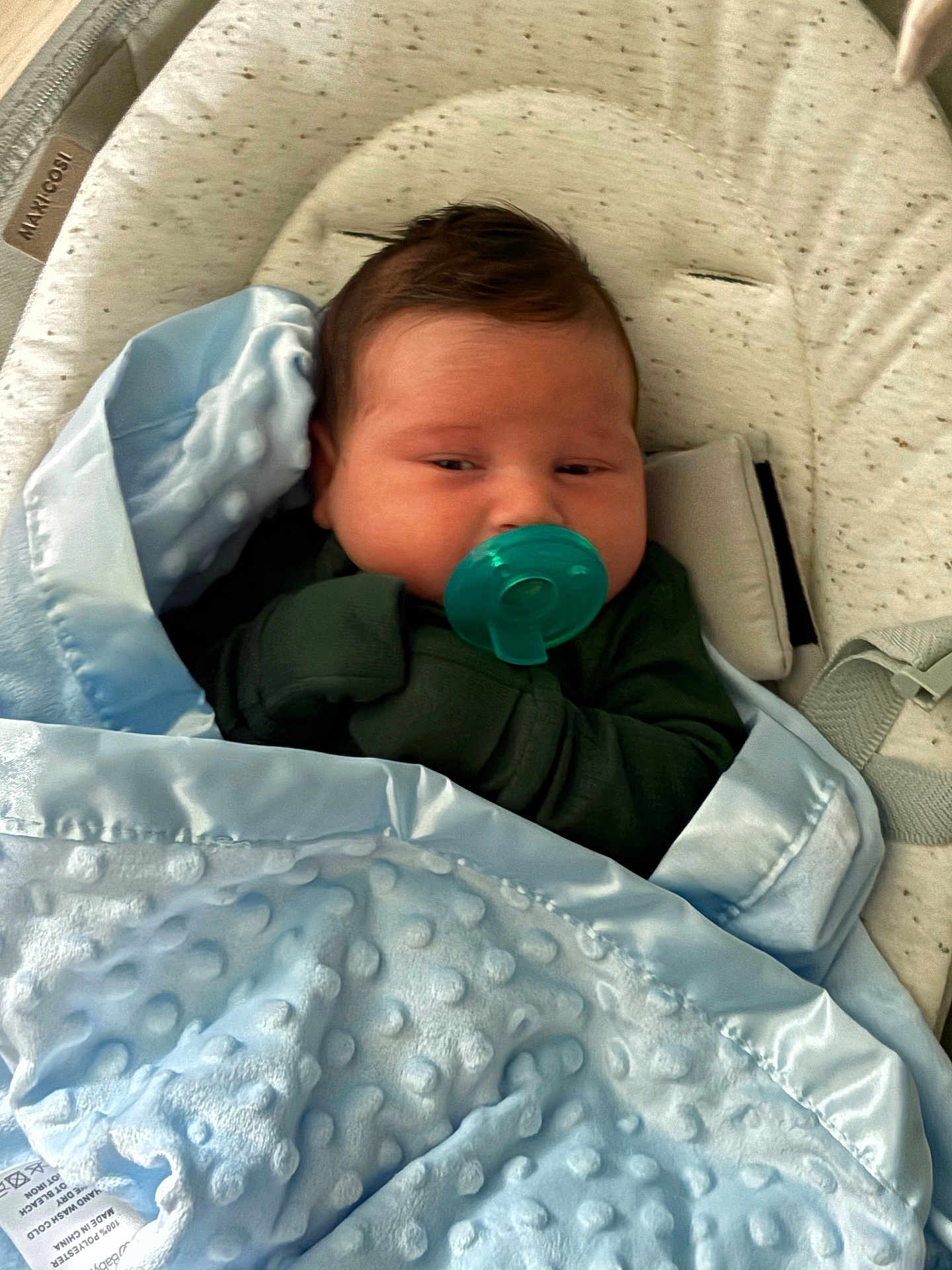 Jack is registered to the contest to win money with this photo: baby, pacifier, blanket, blue_blanket, baby_seat, infant, sleepy, cute, child, soft_texture, resting, cozy, clothing, indoors, comfort, young_child, face, head, wrapped, peaceful