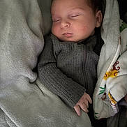 Jack is registered to the contest to win money with this photo: baby, sleeping, blanket, cozy, infant, child, soft, cute, peaceful, clothing, hand, portrait, closeup, rest, comfort, warm, indoor, young, person, sleep