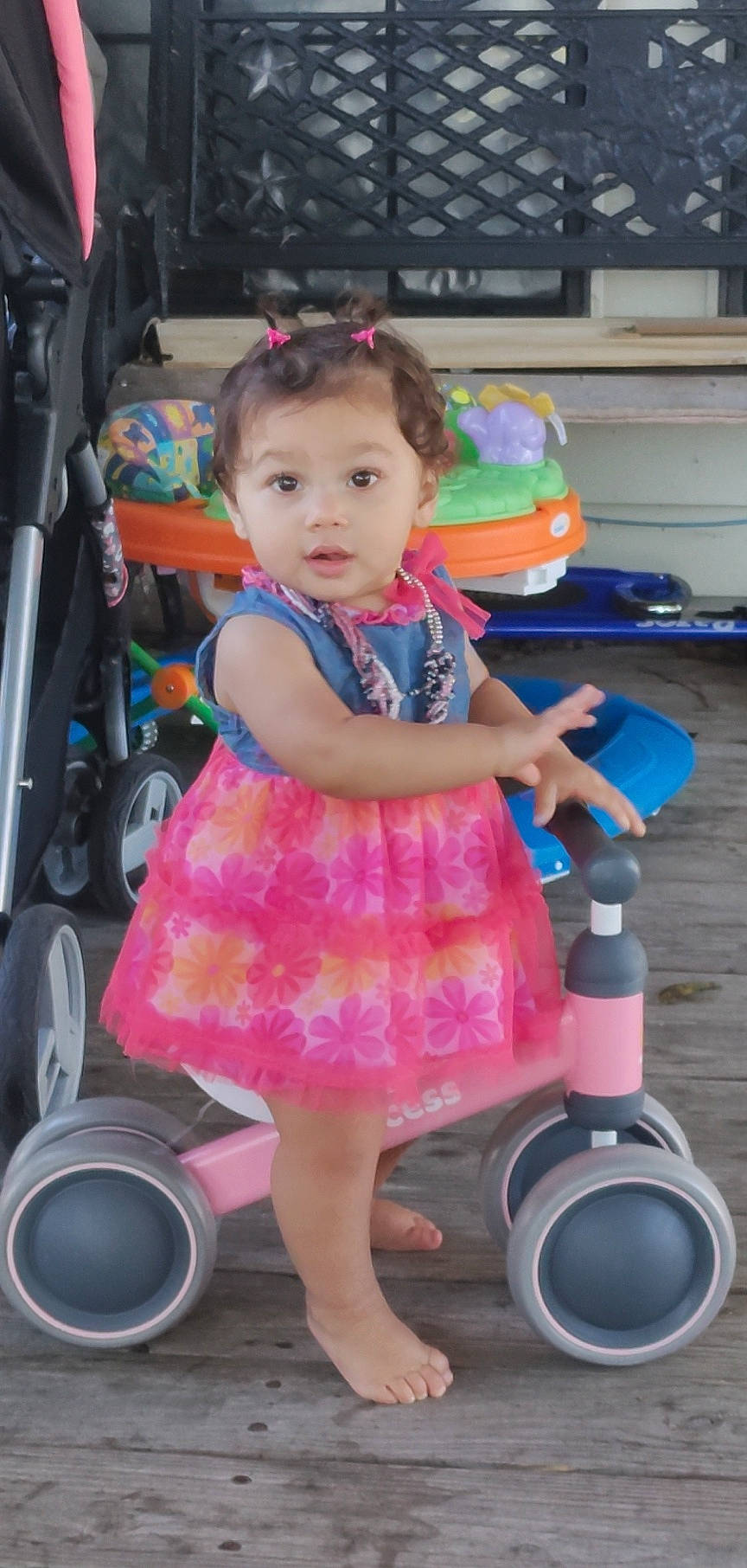 Ny Avia is registered to the contest to win money with this photo: automotive_tire, baby_toddler_clothing, blue, child, dress, electric_blue, fun, magenta, motor_vehicle, person, photograph, pink, product, purple, riding_toy, snapshot, sneakers, tire, toddler, wheel