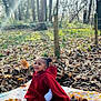 Chinyere joined the competition — help win amazing prizes! apple, baby, blanket, clothing, coat, face, fashion, food, fruit, head, leaf, outdoors, person, photography, plant, portrait, produce, sitting, tree, vegetation