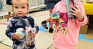 Alina joined the competition — help win amazing prizes! child, toddler, ice_cream, snack, pink_hoodie, tie_dye_outfit, sneakers, outdoor, sidewalk, people, smile, food, fun, playful, casual, daytime, happy, portrait, cute, friends