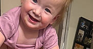 Angelina joined the competition — help win amazing prizes! toddler, child, smiling, pink_shirt, patterned_pants, indoor, family_photos, happy, playful, blue_eyes, rosy_cheeks, short_hair, person, human_hand, holding, portrait, candid, cute, baby, young_child