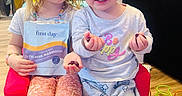 Rose joined the competition — help win amazing prizes! child, children, indoor, toy, bead_maze, chair, clothing, pajamas, gummies, packet, floor, home, smiling, sitting, person, cute, playful, young, kids, face