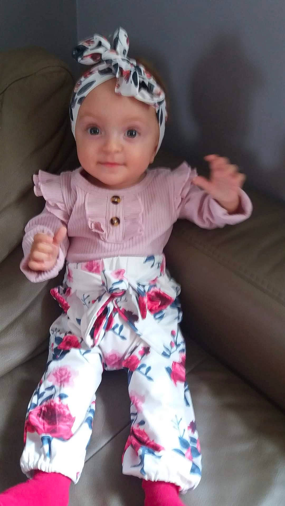 Katharina participe au concours pour gagner de l'argent avec cette photo : baby, baby_toddler_clothing, child, doll, eye, eyelash, fashion_accessory, happy, headgear, headwear, jewellery, linens, magenta, pattern, person, pink, skin, sleeve, smile, textile