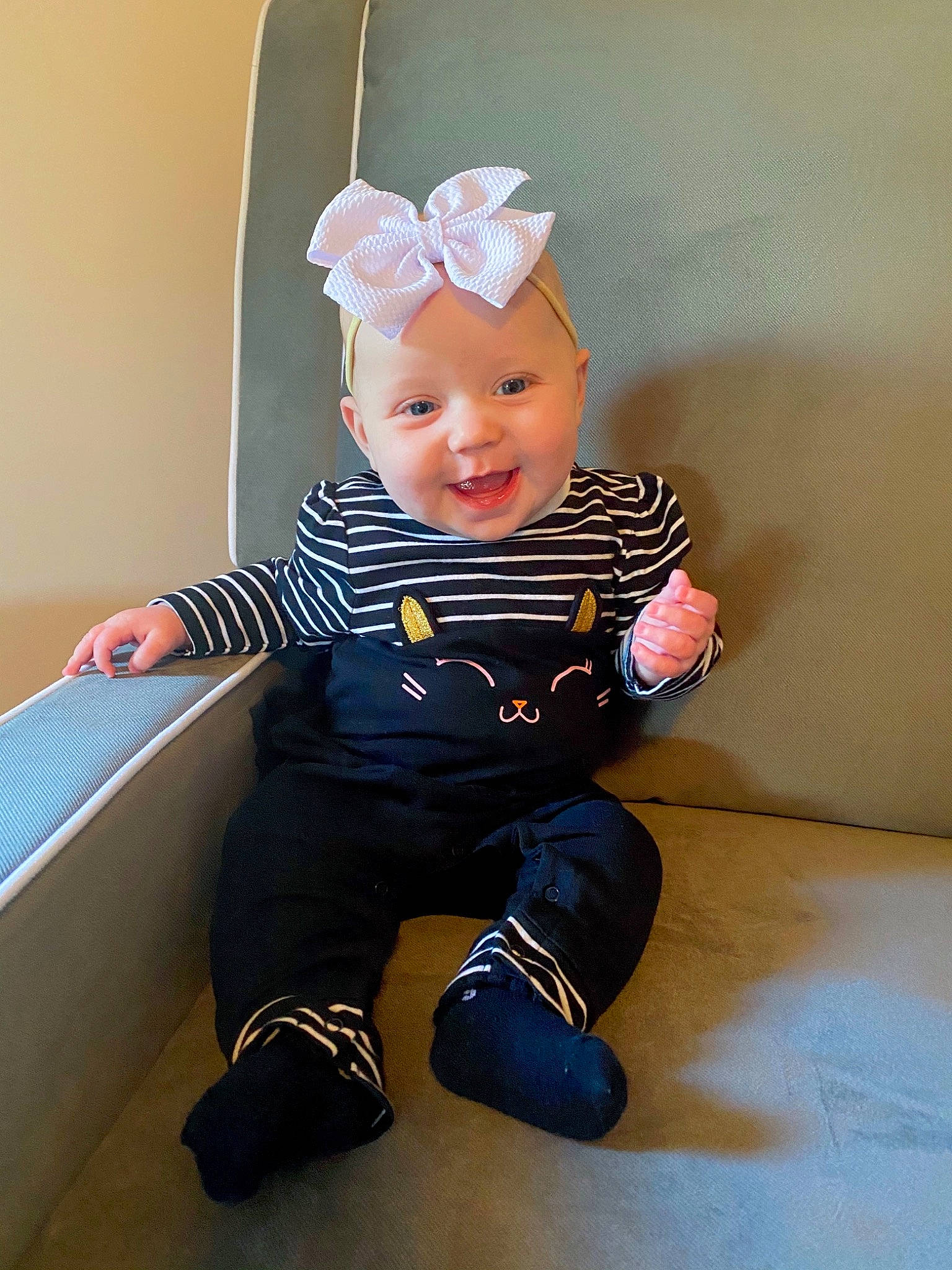 Annika is registered to the contest to win money with this photo: baby, baby_products, baby_toddler_clothing, cheek, child, ear, headgear, headwear, person, room, sitting, sleeve, toddler