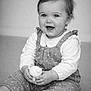 baby, barefoot, black_and_white, child, clothing, cute, face, feet, hands, happy, indoor, infant, long_sleeve, monochrome, overalls, portrait, sitting, smiling, toddler, toy