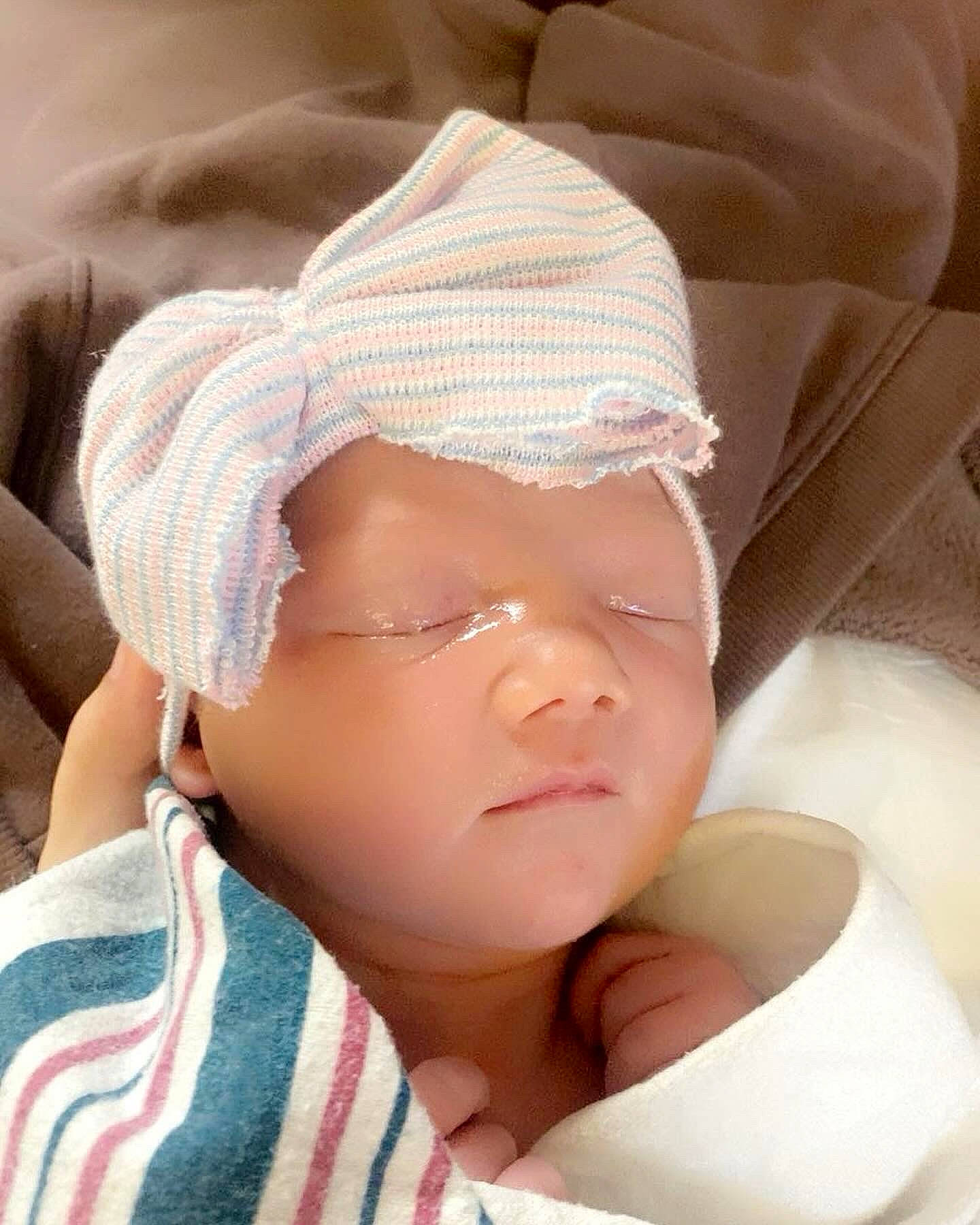 Aria'Grey is registered to the contest to win money with this photo: abdomen, baby, baby_sleeping, baby_toddler_clothing, cap, cheek, child, comfort, eyelash, finger, gesture, happy, hat, headgear, headwear, lip, nail, pattern, person, portrait_photography