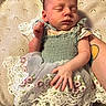 Nara joined the competition — help win amazing prizes! newborn, baby, sleeping, infant, portrait, indoor, cushion, dress, floral, lace, fabric, cozy, peaceful, resting, tattoo, adult_arm, hand, closed_eyes, sitting, photography