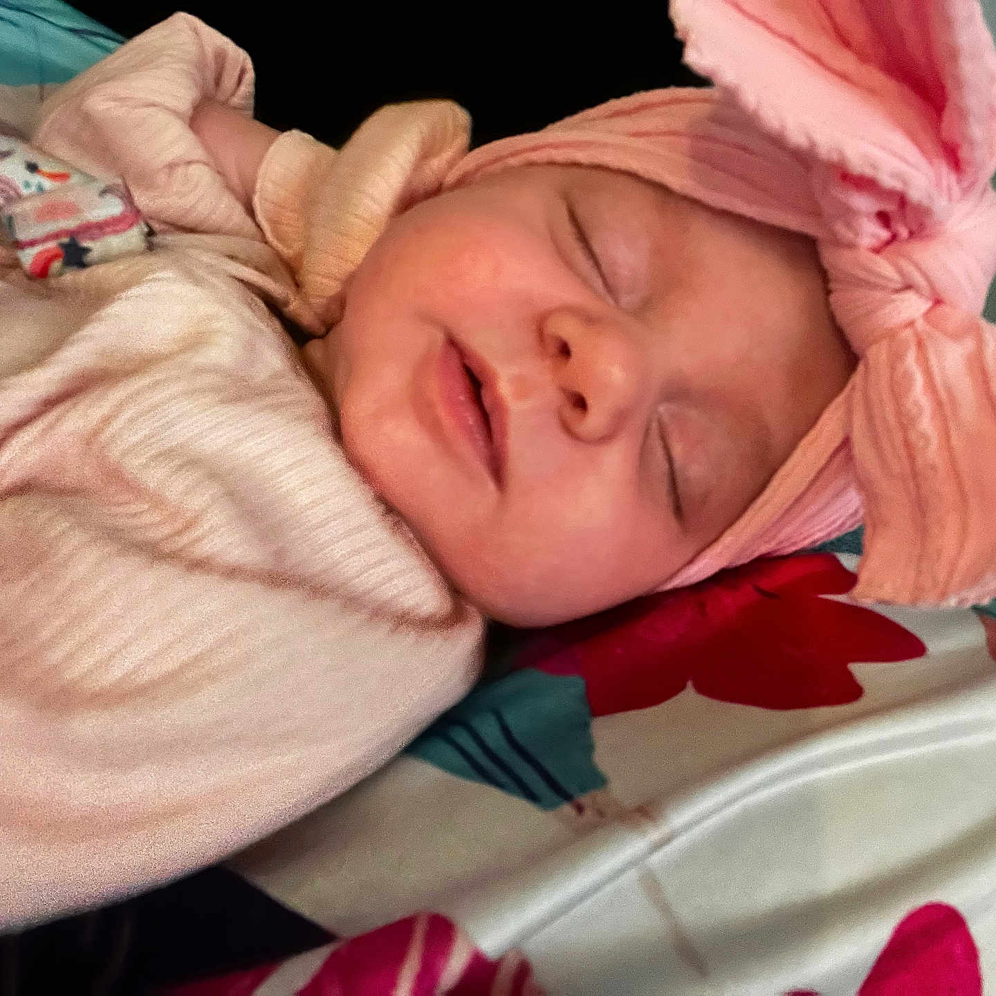Nara is registered to the contest to win money with this photo: newborn, baby, infant, sleeping, portrait, face, headwrap, pink, blanket, swaddled, peaceful, indoors, closeup, resting, eyes_closed, clothing, floral, bedding, cozy, photography