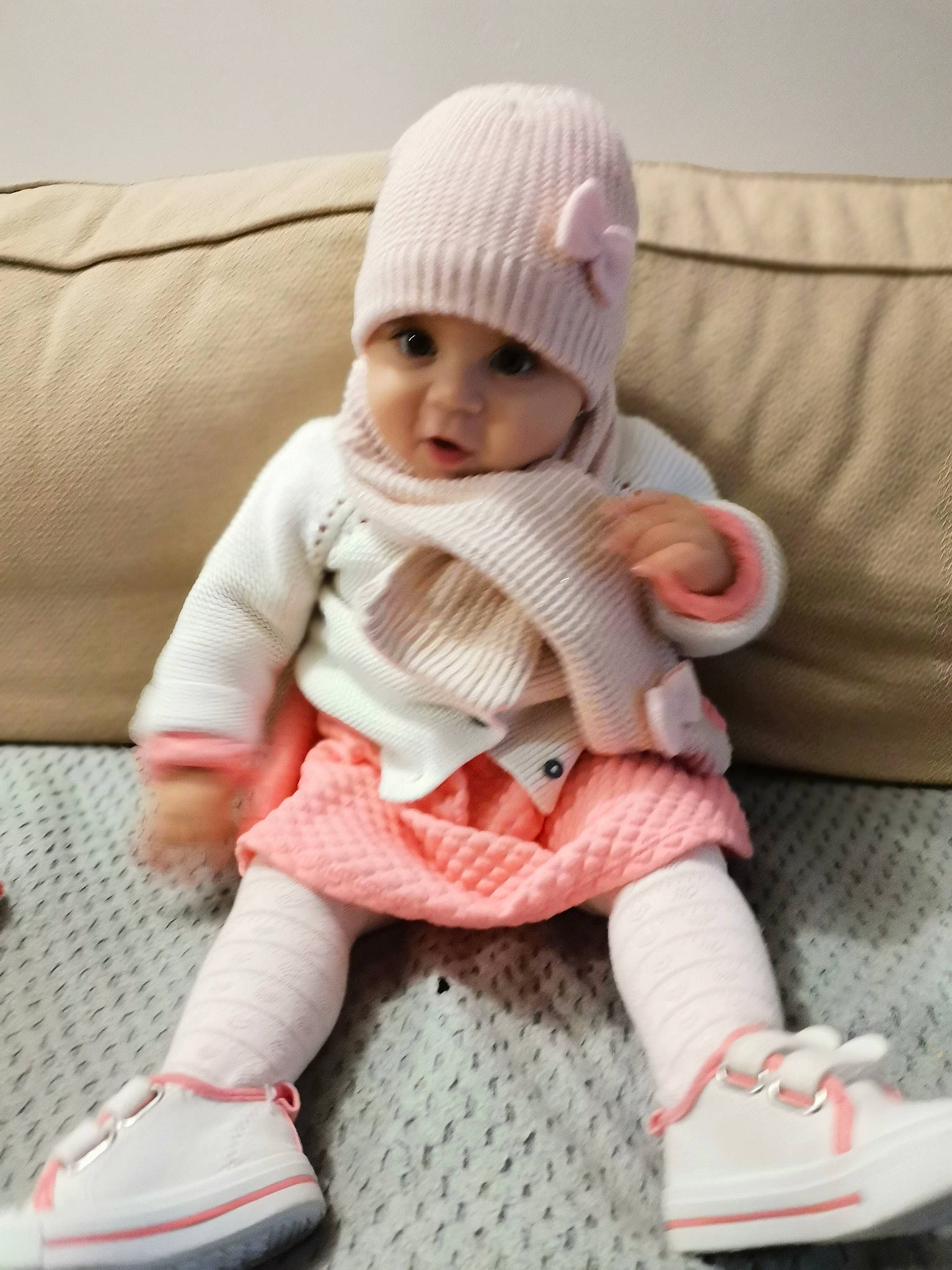 Vladiana participe au concours pour gagner de l'argent avec cette photo : baby, baby_toddler_clothing, cap, child, comfort, couch, doll, headwear, knee, lap, outerwear, pattern, person, pink, shoe, sleeve, sock, textile, toddler, toy