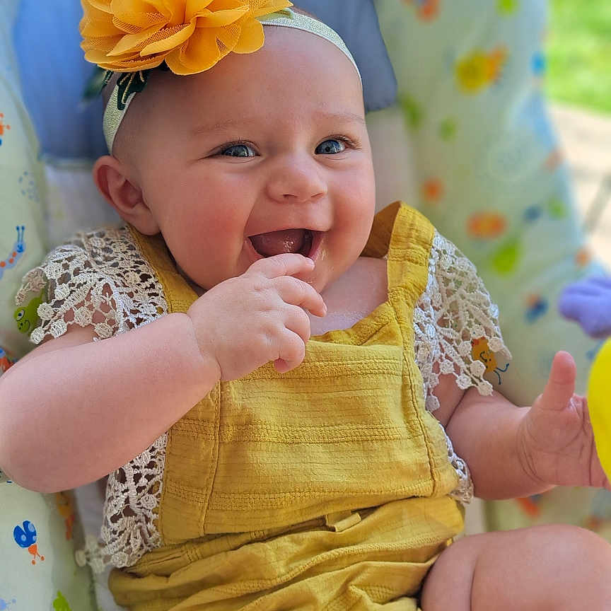 Micah joined the competition — help win amazing prizes! baby, bodypart, clothing, cushion, dress, face, finger, flower, furniture, hand, happy, hat, head, homedecor, newborn, person, petal, photography, plant, portrait