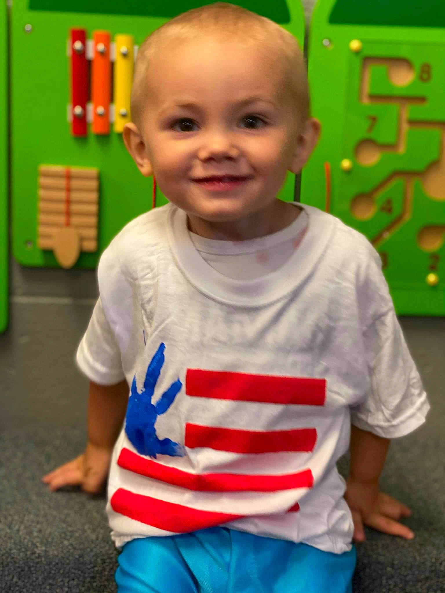 Lyncoln is registered to the contest to win money with this photo: baby, baby_toddler_clothing, blue, child, electric_blue, eye, fun, green, happy, joy, kindergarten, leisure, nose, organ, person, red, sleeve, smile, standing, t_shirt