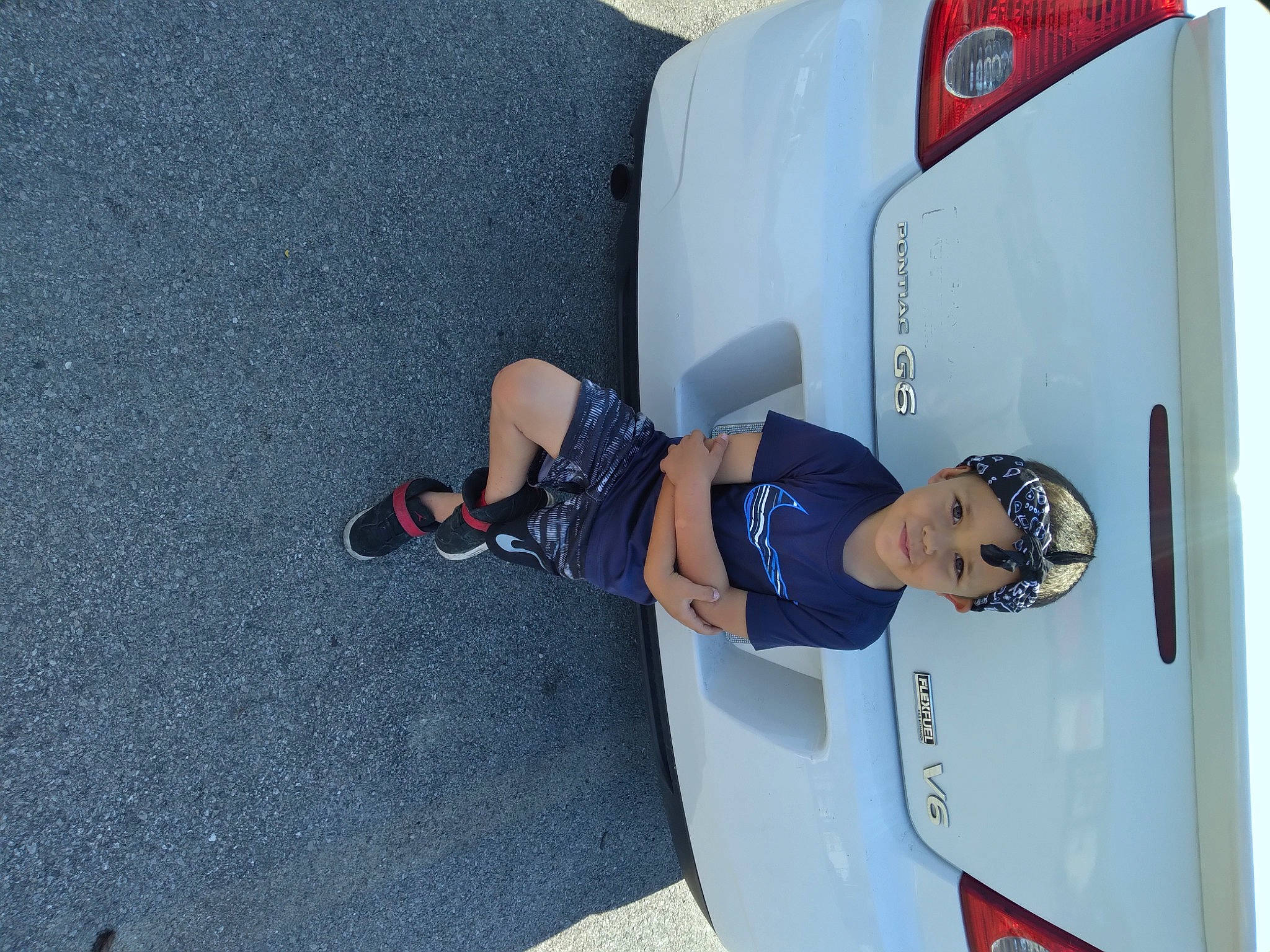 Deacon is registered to the contest to win money with this photo: auto_part, automotive_design, automotive_exterior, automotive_lighting, automotive_tire, automotive_wheel_system, bumper, car, electric_blue, family_car, fender, headwear, hood, luxury_vehicle, motor_vehicle, person, recreation, rim, smile, trunk