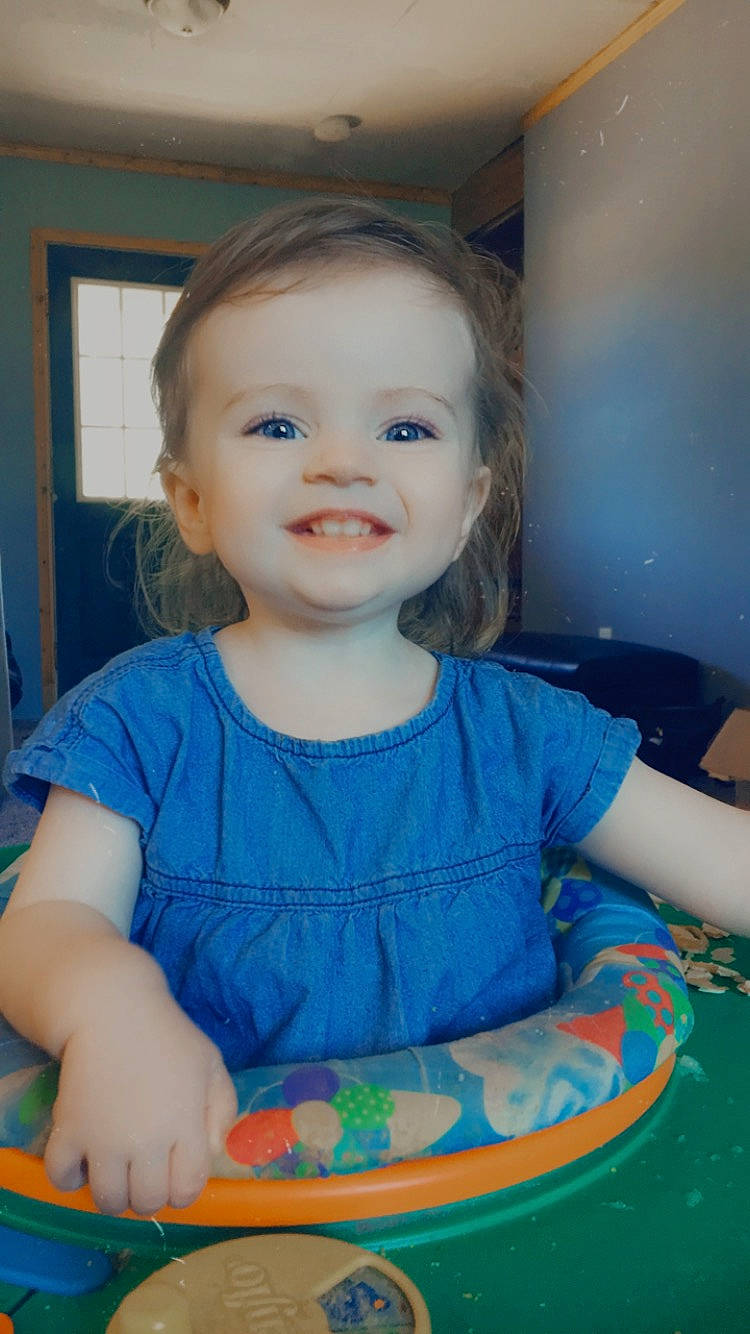 Sharlotte is registered to the contest to win money with this photo: baby, cheek, child, face, head, iris, joy, person, play, sitting, smile, toddler