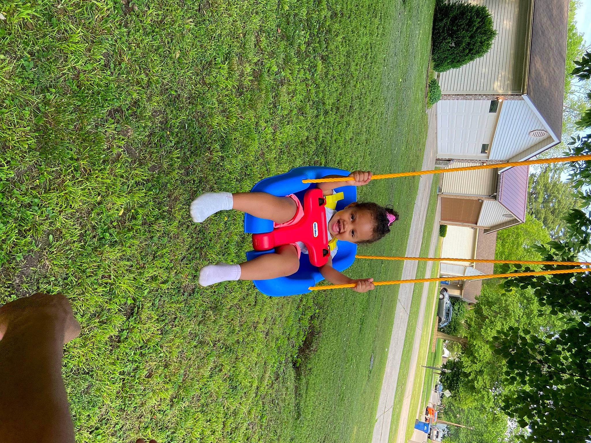 Amira joined the competition — help win amazing prizes! baby, child, fun, grass, grassland, green, lawn, leisure, outdoor_play_equipment, people_in_nature, person, plant, play, playground, pole, recreation, shrub, swing, t_shirt, toddler