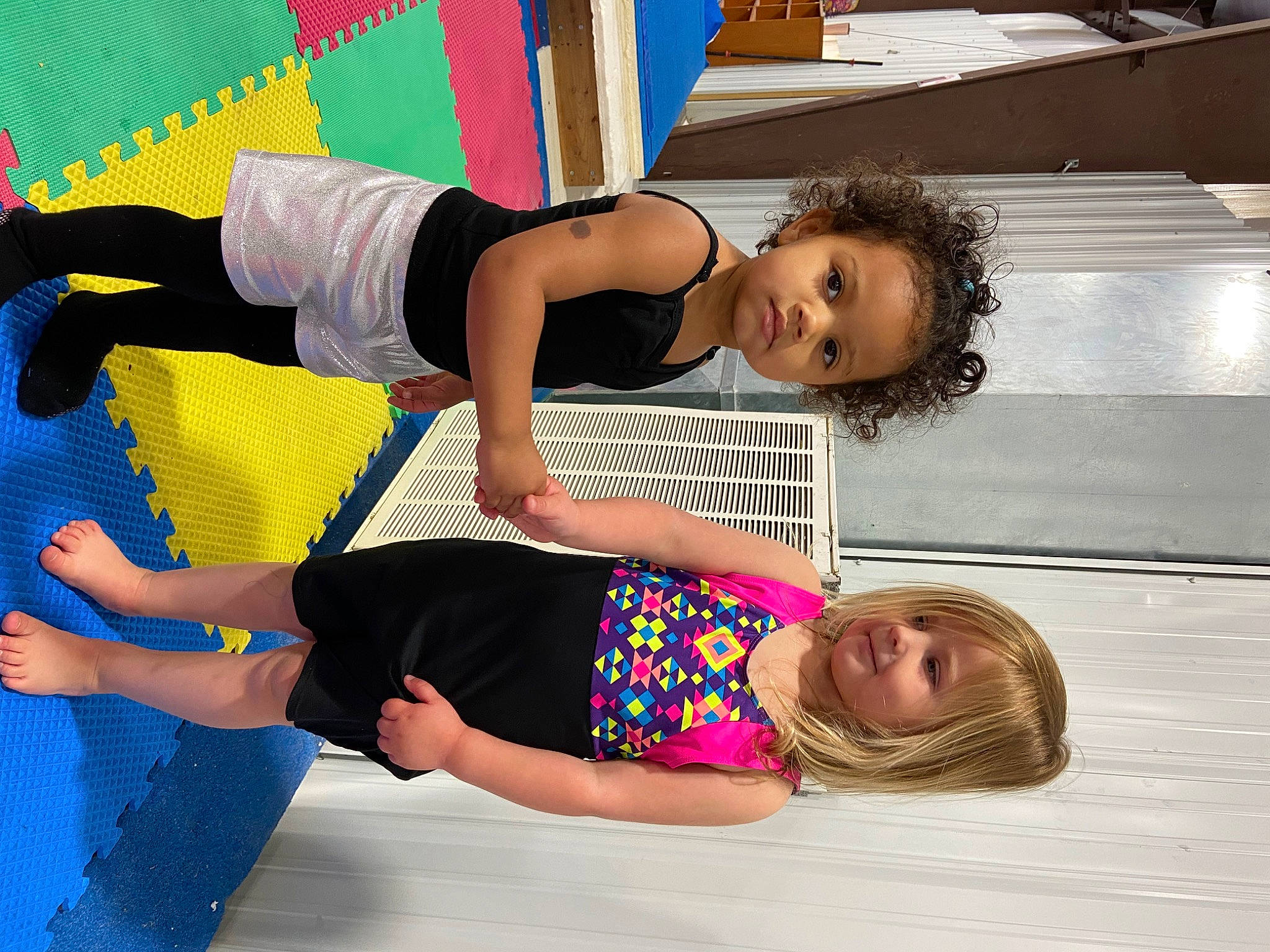 Amira is registered to the contest to win money with this photo: balance, barefoot, child, comfort, elbow, facial_expression, fun, happy, human_leg, joint, joy, knee, leisure, person, sleeve, smile, snapshot, t_shirt, thigh, toddler