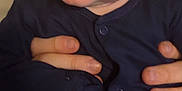 Hugo is registered to the contest to win money with this photo: baby, infant, child, face, smile, hands, clothing, onesie, person, cute, happy, skin, blue, eyes, expression, holding, joyful, portrait, closeup, human