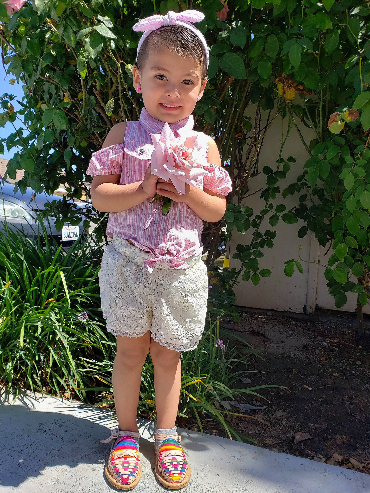Izliah is registered to the contest to win money with this photo: baby, baby_toddler_clothing, child, joy, person, pink, plant, shoe, skin, smile, toddler, vacation