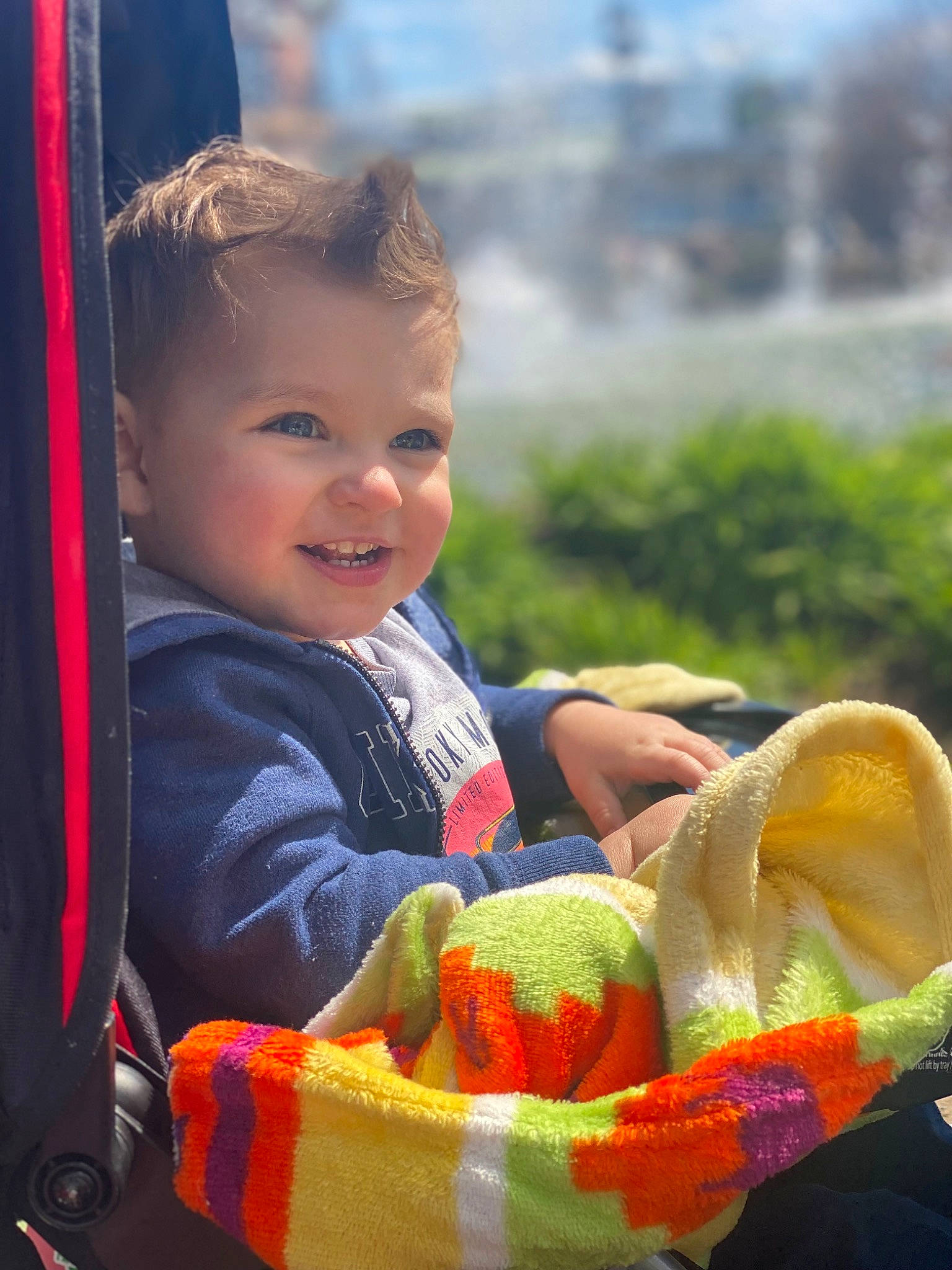 Bentley joined the competition — help win amazing prizes! baby, baby_products, child, citrus, facial_expression, fruit, fun, grass, happy, leisure, natural_foods, people_in_nature, person, plant, recreation, sitting, smile, stuffed_toy, toddler, travel