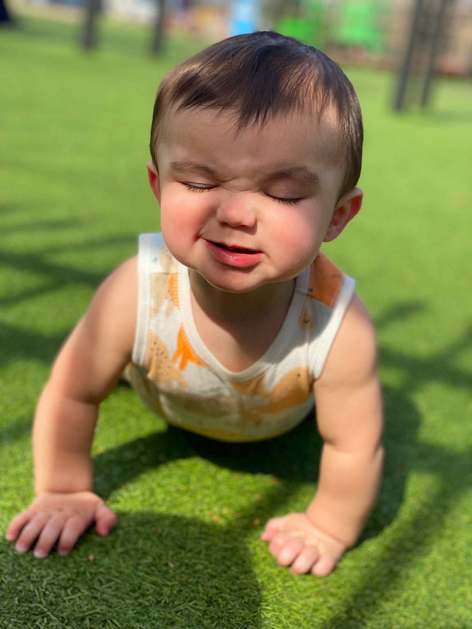 Brysen is registered to the contest to win money with this photo: baby, baby_toddler_clothing, cheek, crawling, eye, face, finger, flooring, grass, green, hair, hand, happy, head, nature, nose, people_in_nature, person, plant, skin