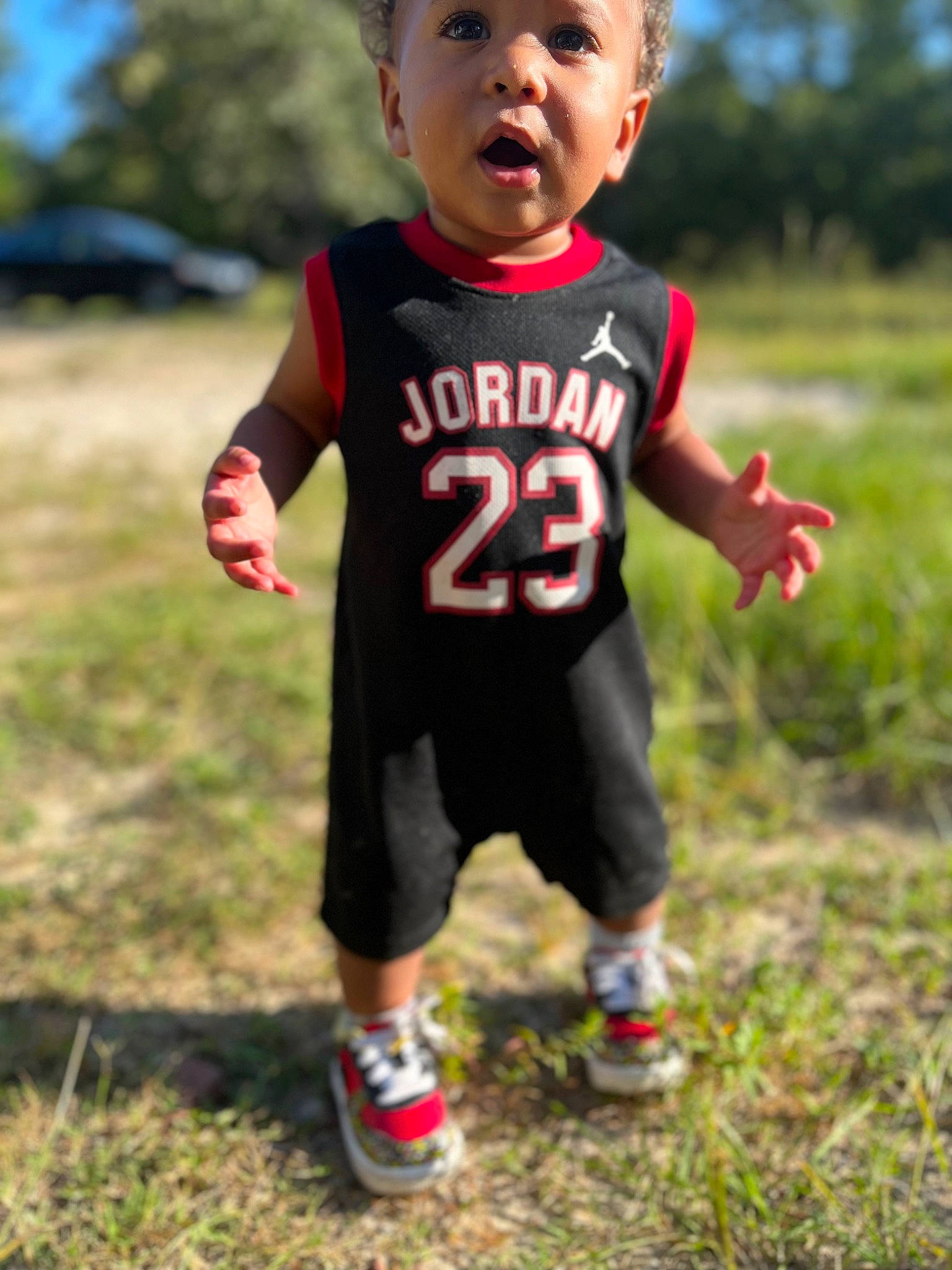 Andre joined the competition — help win amazing prizes! baby_toddler_clothing, child, eye, fun, gesture, grass, grassland, happy, leisure, people_in_nature, person, plant, recreation, running, shorts, sky, sleeve, soil, surprise, t_shirt