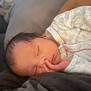 Leonora Rey joined the competition — help win amazing prizes! newborn, baby, sleeping, infant, onesie, hand, face, peaceful, soft, blanket, closeup, cute, cozy, child, portrait, resting, indoors, young, human, toddler