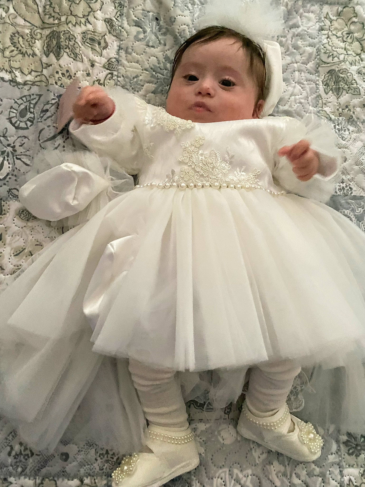 Amalia Martinica is registered to the contest to win money with this photo: baby, baby_toddler_clothing, bridal_clothing, bridal_party_dress, dress, embellishment, face, facial_expression, flash_photography, gown, hairstyle, happy, headgear, iris, person, pink, shoe, skin, sleeve, toddler