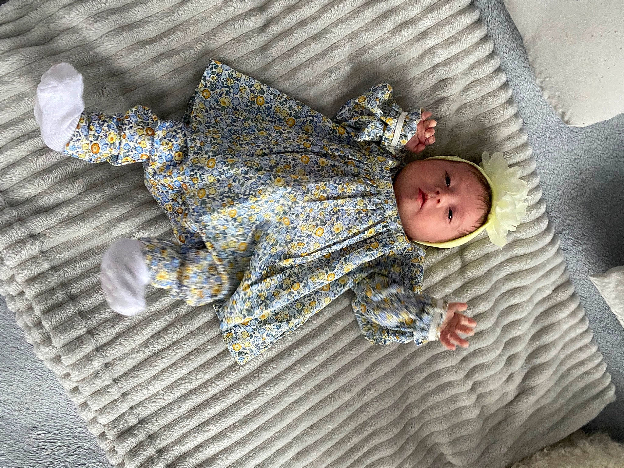 Amalia Elena Martinica is registered to the contest to win money with this photo: baby, baby_products, baby_toddler_clothing, child, comfort, floor, flooring, grey, headwear, linens, pattern, person, room, sitting, sleep, sleeve, textile, toddler, wood, wool