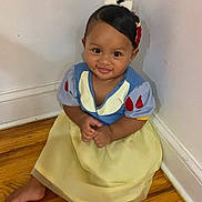 Liviyanna is registered to the contest to win money with this photo: baby, barefoot, child, costume, cute, dress, floor, hair_bow, happy, head, indoor, person, portrait, sitting, smile, snow_white, toddler, wall, wood_floor, young_child
