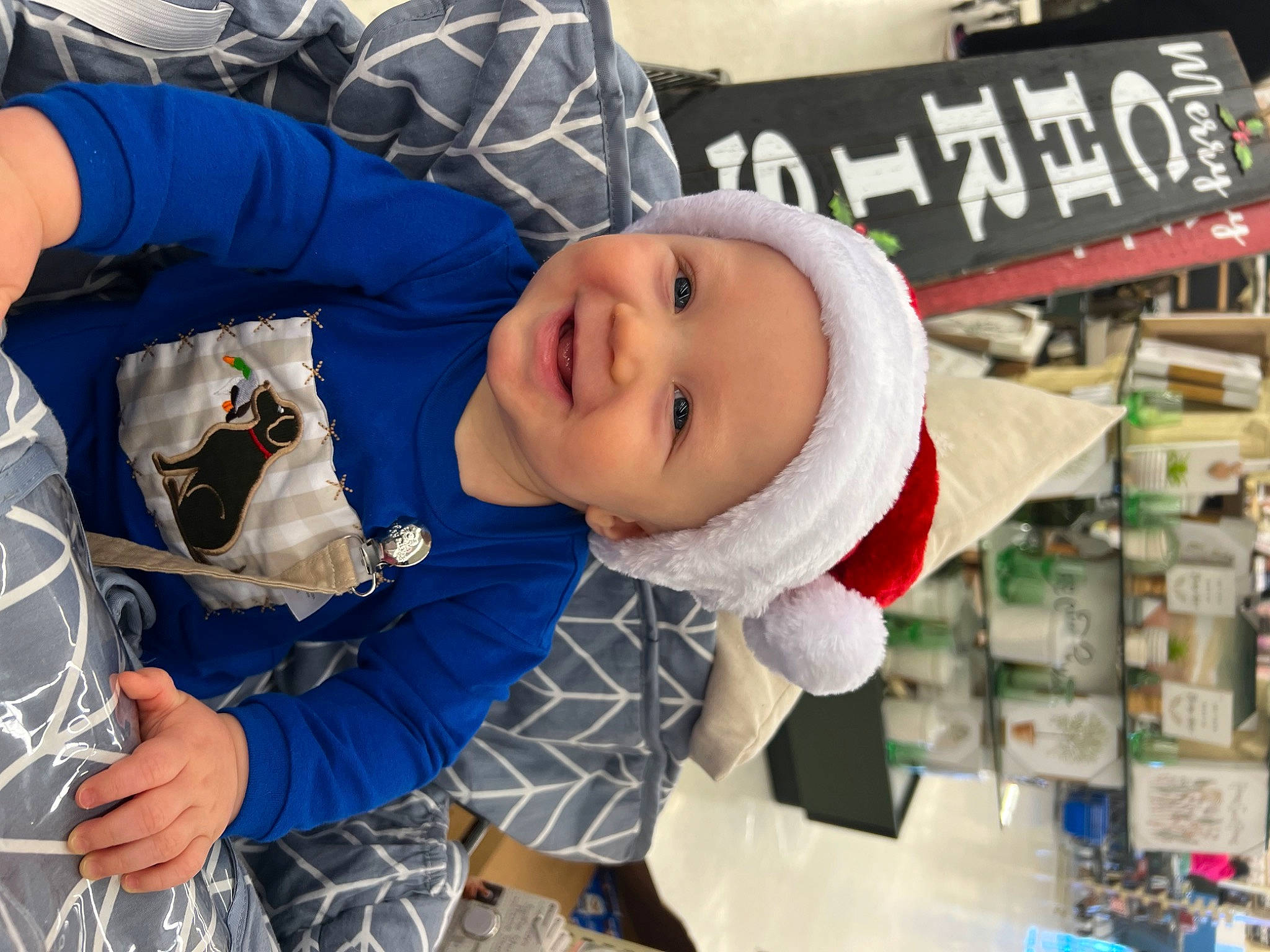 Braxton is registered to the contest to win money with this photo: baby, baby_toddler_clothing, child, customer, electric_blue, event, fun, glove, happy, hat, headwear, joy, person, product, recreation, retail, service, smile, toddler, winter