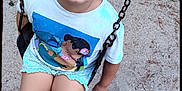 Ezra joined the competition — help win amazing prizes! child, swing, playground, sand, braids, tshirt, yellow_crocs, smiling, outdoor, summer, happy, casual_clothing, play, fun, person, young, cute, park, feet, legs
