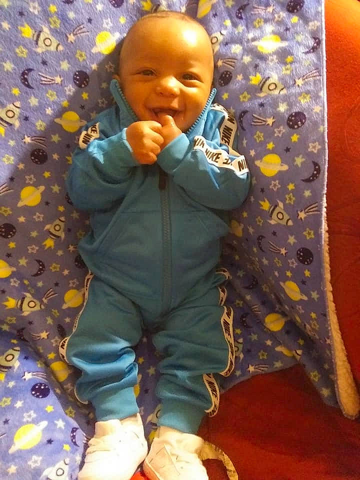 Rhy'Dian is registered to the contest to win money with this photo: baby, baby_laughing, baby_products, baby_toddler_clothing, cheek, child, face, laugh, linens, mouth, nightwear, nose, person, sleeve, sock, toddler, tongue