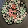 baby, ball_pit, balls, smiling, happy, infant, play, toy, indoor, soft, pastel_colors, child, cute, diaper, green_clothing, grey, white, mint, relaxing, enclosure