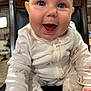 Emmalee joined the competition — help win amazing prizes! baby, child, smiling, pajamas, flamingo, animal_print, chair, indoor, cute, happy, face, clothing, person, infant, portrait, seated, wood, background, closeup, expression