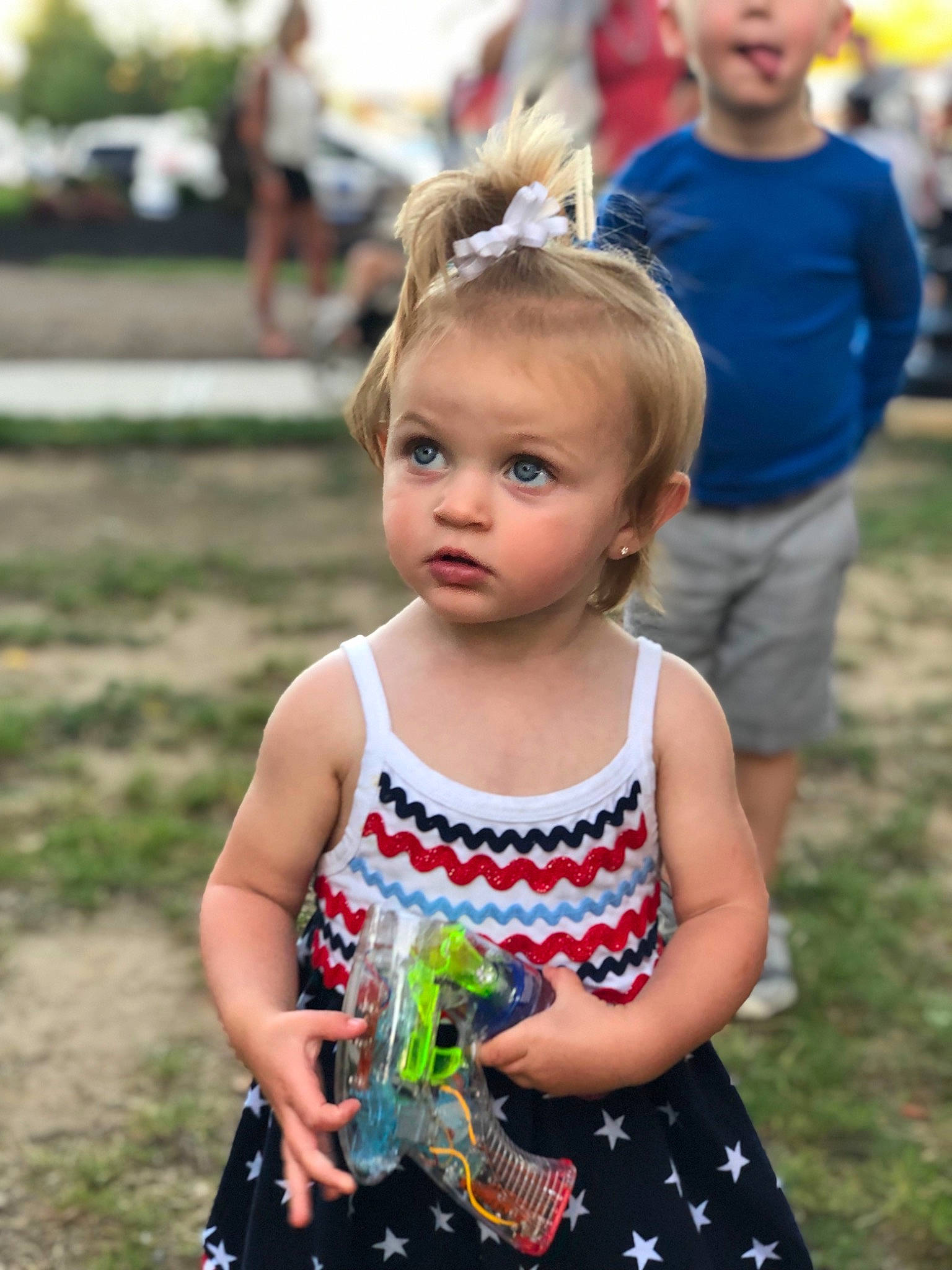 Molly is registered to the contest to win money with this photo: baby, blond, child, dress, fun, grass, hair, hairstyle, people, person, plant, recreation, style, summer, toddler, vacation